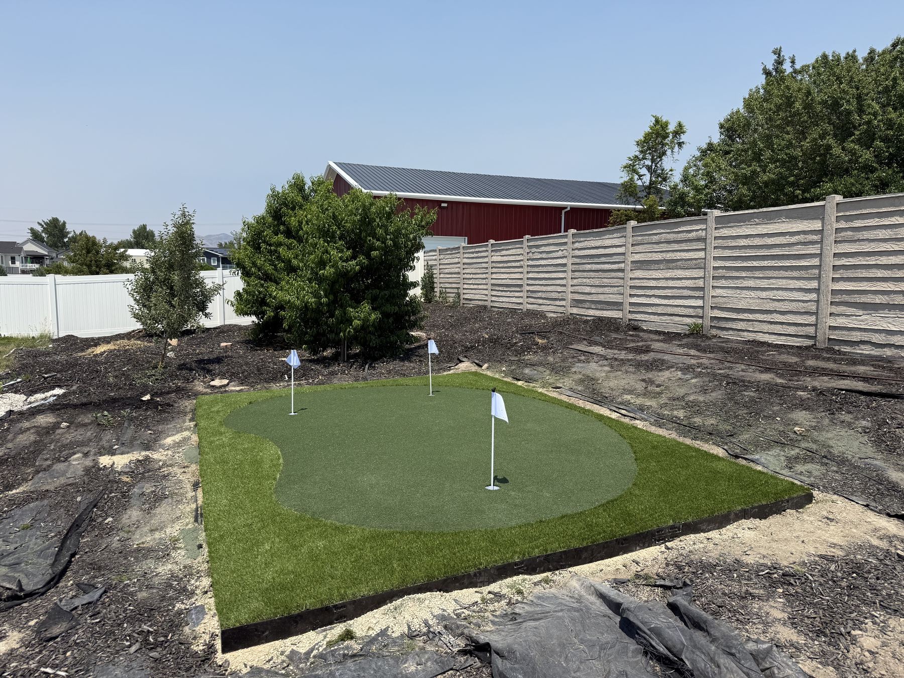New build putting green install with fresh landscaping